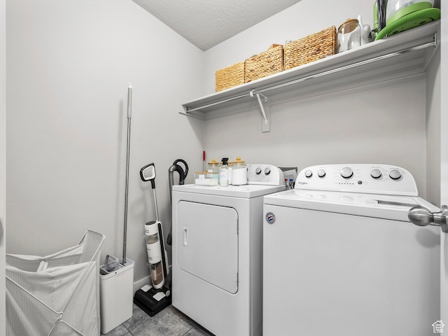 1463 S Lake View Terrace Rd, Saratoga Springs, UT 84045 - clothes washing area featuring light tile patterned floors, laundry area, washer and clothes dryer, and a textured ceiling