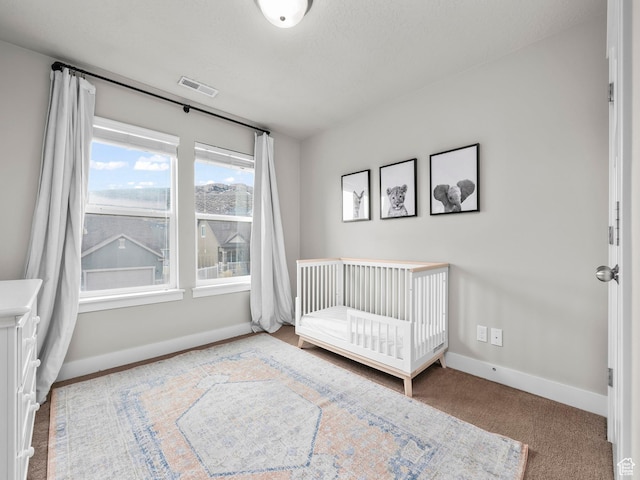 1463 S Lake View Terrace Rd, Saratoga Springs, UT 84045 - unfurnished bedroom with a crib, light colored carpet, visible vents, and baseboards