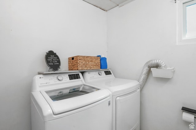laundry room with laundry area and washer and clothes dryer