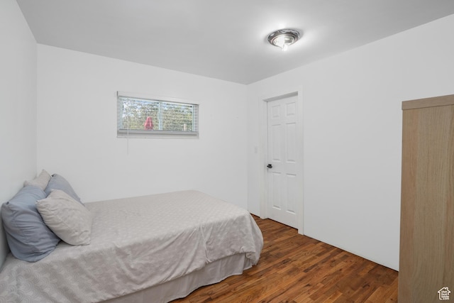 bedroom featuring dark wood-style floors