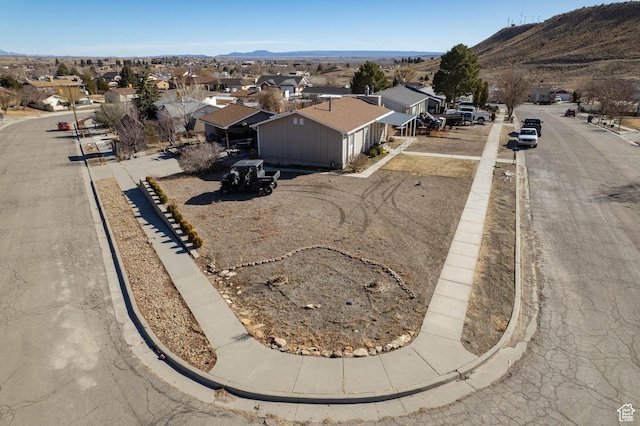 birds eye view of property featuring a residential view and a mountain view