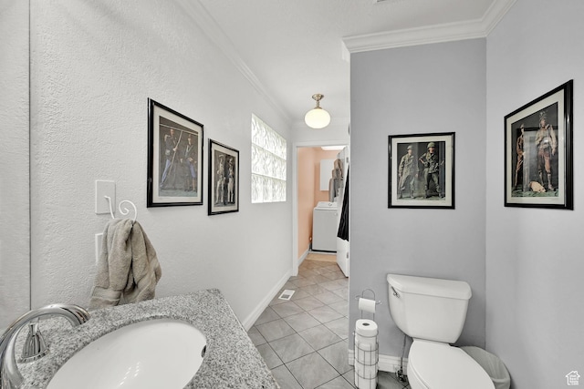 59 Belmore Dr, Kaysville, UT 84037 - bathroom featuring toilet, ornamental molding, washer / clothes dryer, tile patterned floors, and a sink