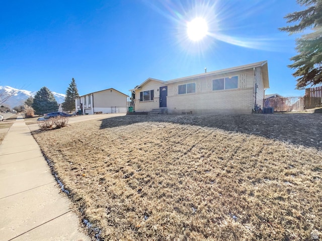 1439 W 1200 N, Layton, UT 84041 - view of front of house with fence, brick siding, and cooling unit