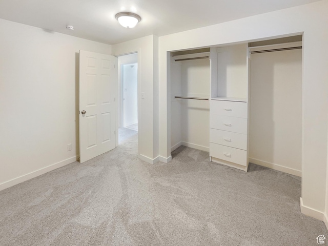1439 W 1200 N, Layton, UT 84041 - unfurnished bedroom with baseboards, a closet, and light colored carpet