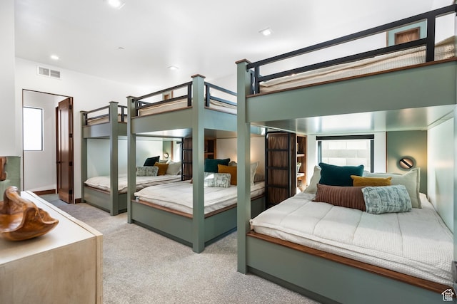 bedroom featuring light carpet, baseboards, visible vents, and recessed lighting