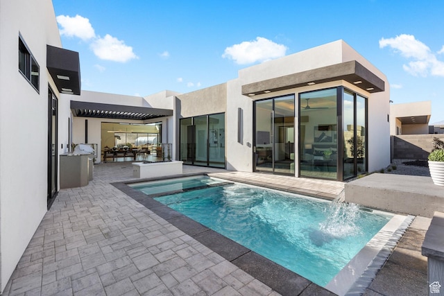 pool with a patio area and fence
