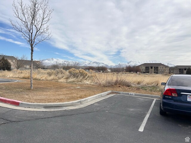 8204 N Cedar Springs Rd E Unit U-12, Eagle Mountain, UT 84005 - uncovered parking lot with a mountain view