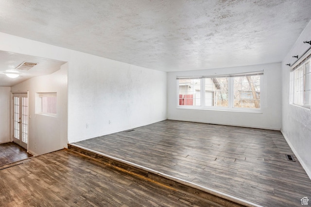 170 S 500 E, Duchesne, UT 84021 - unfurnished room featuring dark wood-type flooring, visible vents, and a textured ceiling