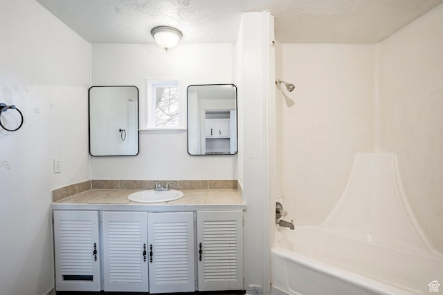 170 S 500 E, Duchesne, UT 84021 - full bathroom featuring a textured ceiling, bathtub / shower combination, and vanity