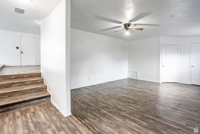 170 S 500 E, Duchesne, UT 84021 - interior space featuring visible vents, baseboards, a ceiling fan, stairway, and dark wood-style floors