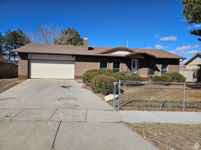 single story home with an attached garage, brick siding, fence, concrete driveway, and a chimney