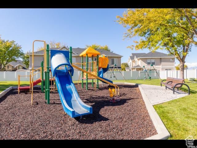 1829 W 1120 S Unit 128, Springville, UT 84663 - community play area featuring a yard, fence, and a residential view