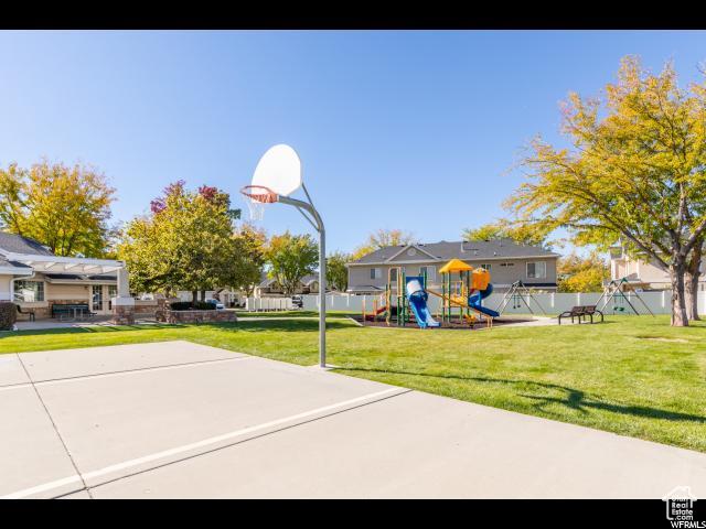 1829 W 1120 S Unit 128, Springville, UT 84663 - view of sport court featuring basketball court, a playground, a lawn, and fence