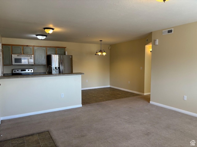 1829 W 1120 S Unit 128, Springville, UT 84663 - kitchen with stainless steel appliances, visible vents, dark carpet, dark countertops, and pendant lighting