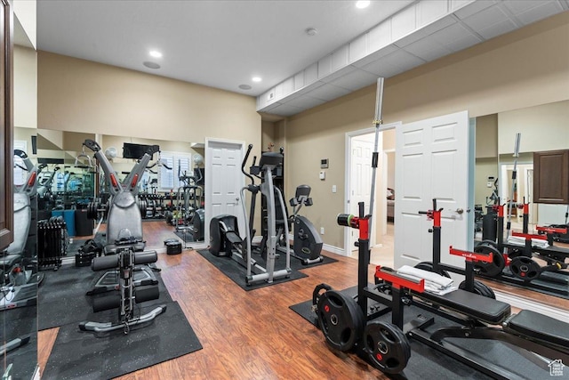 gym featuring baseboards and wood finished floors