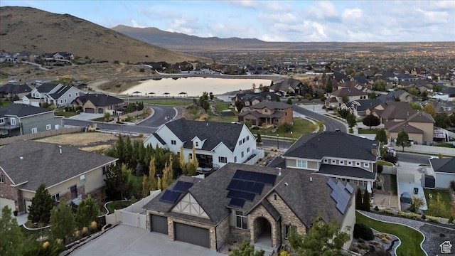 birds eye view of property with a residential view and a water and mountain view