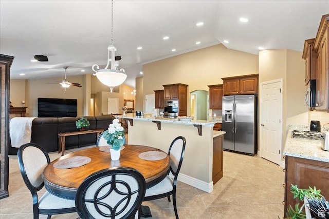 dining room featuring arched walkways, light tile patterned floors, recessed lighting, a ceiling fan, and high vaulted ceiling
