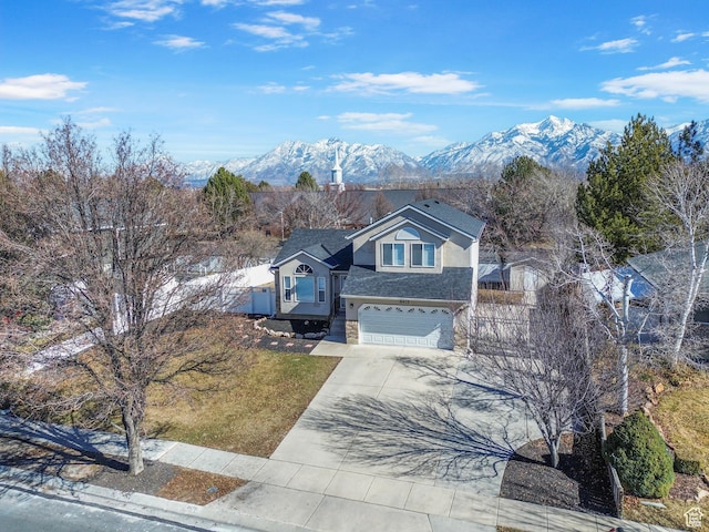 8475 S 1520 W, West Jordan, UT 84088 - traditional-style house with stucco siding, concrete driveway, a mountain view, a garage, and stone siding