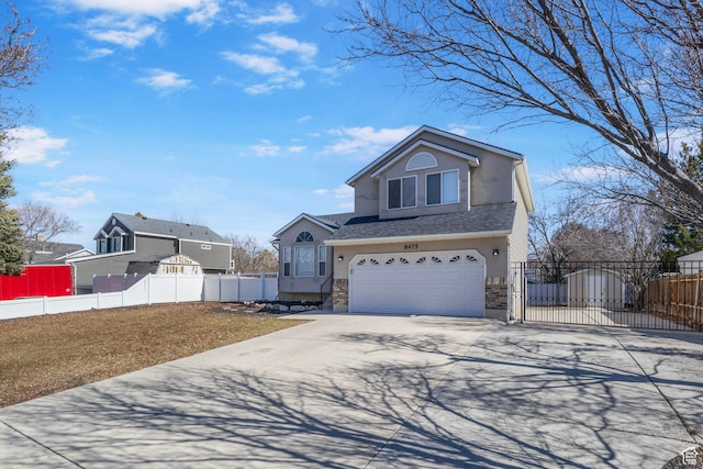 8475 S 1520 W, West Jordan, UT 84088 - view of front of house featuring a garage, driveway, fence, and stucco siding