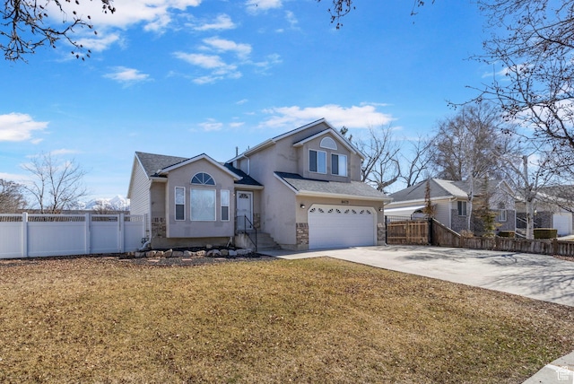 8475 S 1520 W, West Jordan, UT 84088 - view of front of house with stucco siding, concrete driveway, fence, a garage, and a front lawn