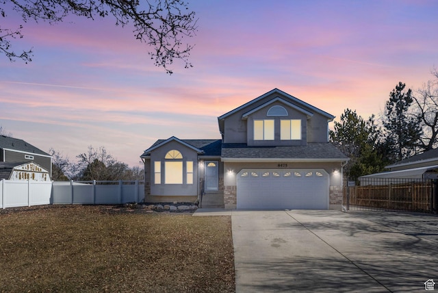 8475 S 1520 W, West Jordan, UT 84088 - traditional home with stucco siding, a shingled roof, concrete driveway, fence, and a garage