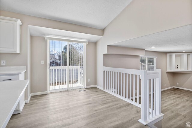 8475 S 1520 W, West Jordan, UT 84088 - interior space featuring light wood-style flooring, baseboards, and a textured ceiling