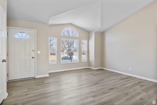 8475 S 1520 W, West Jordan, UT 84088 - foyer entrance featuring lofted ceiling, baseboards, and wood finished floors