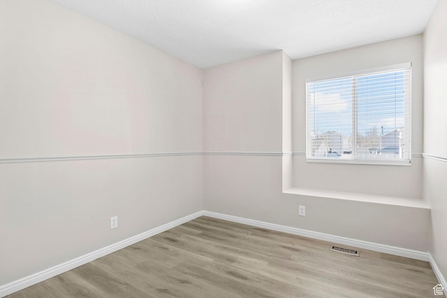 8475 S 1520 W, West Jordan, UT 84088 - spare room with visible vents, baseboards, and wood finished floors