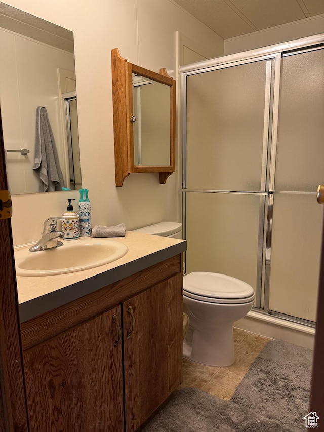 1526 N Dixie Downs Rd N 36, St George, UT 84770 - full bathroom featuring toilet, a shower with door, and vanity