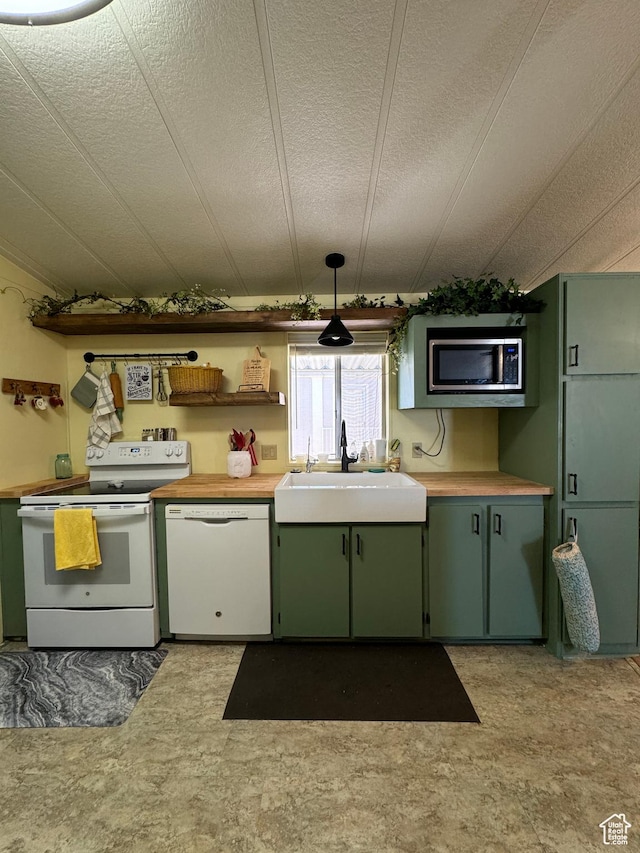 1526 N Dixie Downs Rd N 36, St George, UT 84770 - kitchen with white appliances, light countertops, a sink, and light floors