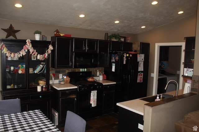 1338 S Glenbarr W, Springville, UT 84663 - kitchen with dark cabinets, a kitchen island, a sink, light countertops, and black appliances