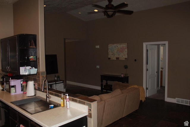 1338 S Glenbarr W, Springville, UT 84663 - kitchen featuring baseboards, visible vents, vaulted ceiling, light countertops, and a sink