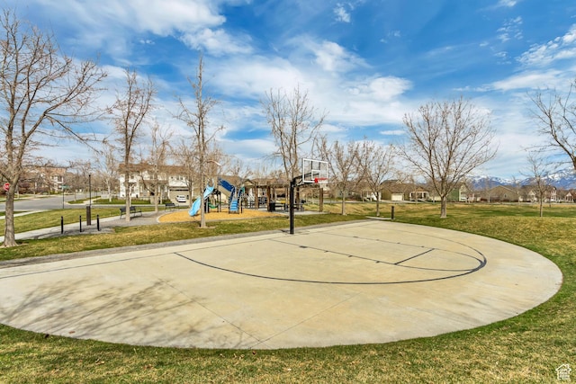 view of basketball court featuring community basketball court, a lawn, and playground community