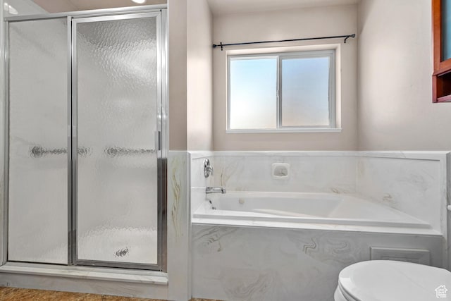 full bath featuring toilet, a shower stall, and a bath