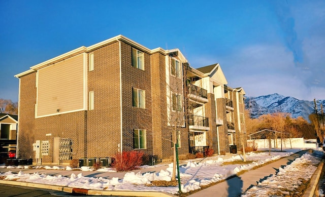 154 E 7th St S Unit A101, Ogden, UT 84404 - snow covered building featuring a mountain view