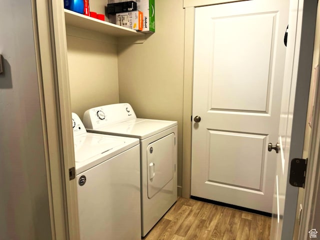 154 E 7th St S Unit A101, Ogden, UT 84404 - laundry room with washer and dryer and light wood-type flooring