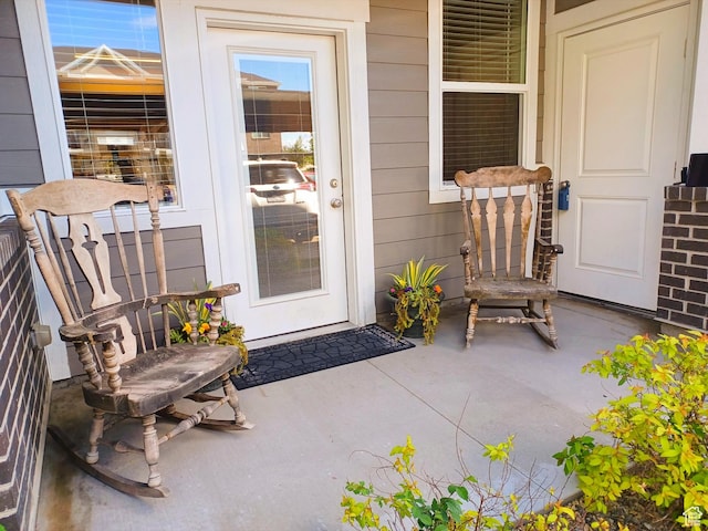 154 E 7th St S Unit A101, Ogden, UT 84404 - view of exterior entry featuring a porch