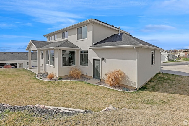 680 E 525 N, Providence, UT 84332 - back of property with a shingled roof, stucco siding, and a lawn