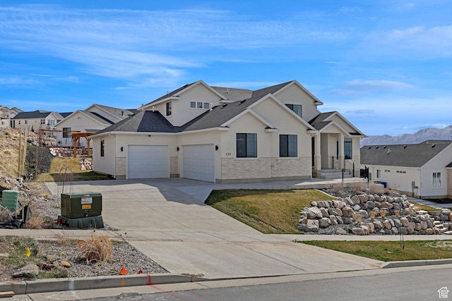 680 E 525 N, Providence, UT 84332 - view of front of property featuring a residential view, a garage, stucco siding, and driveway