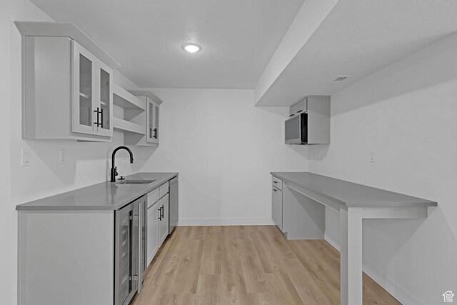 680 E 525 N, Providence, UT 84332 - kitchen with baseboards, a sink, light wood-type flooring, wine cooler, and recessed lighting