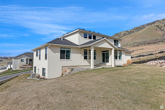 680 E 525 N, Providence, UT 84332 - back of house featuring a yard, a mountain view, and stucco siding