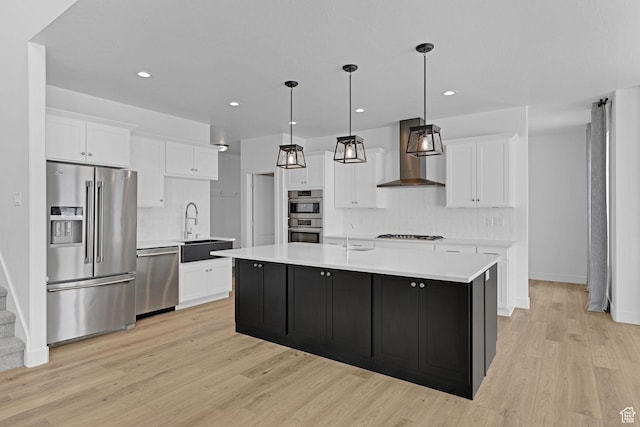 680 E 525 N, Providence, UT 84332 - kitchen with tasteful backsplash, wall chimney range hood, light countertops, stainless steel appliances, and light wood finished floors