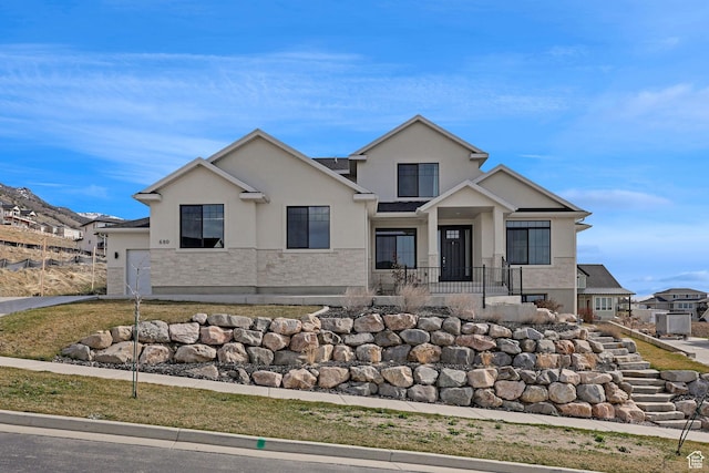 680 E 525 N, Providence, UT 84332 - view of front of home featuring a garage and stucco siding