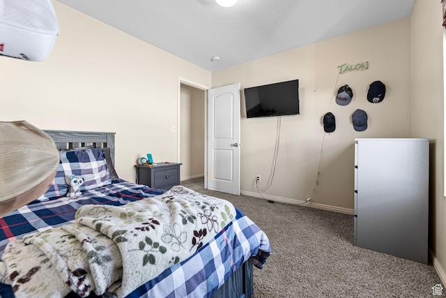 carpeted bedroom with baseboards