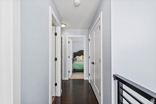 1313 E Daffodil Ct, Layton, UT 84040 - hallway featuring dark wood-style flooring and baseboards