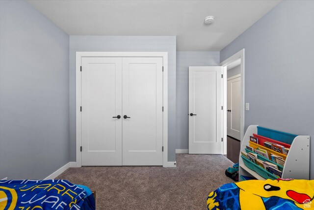 1313 E Daffodil Ct, Layton, UT 84040 - bedroom featuring dark colored carpet, a closet, and baseboards