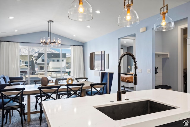 1313 E Daffodil Ct, Layton, UT 84040 - kitchen with light stone counters, lofted ceiling, hanging light fixtures, open floor plan, and a sink