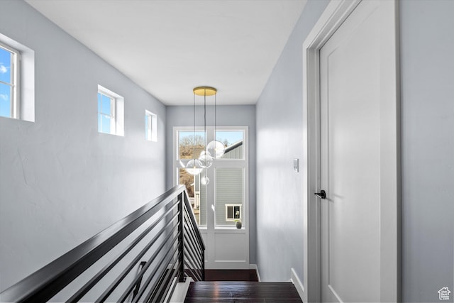 1313 E Daffodil Ct, Layton, UT 84040 - stairway featuring baseboards and a notable chandelier