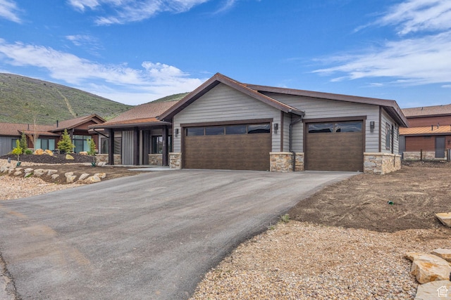 272 Thorn Creek Dr, Kamas, UT 84036 - single story home featuring stone siding, driveway, an attached garage, and a mountain view