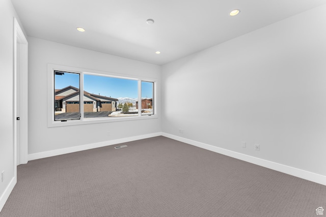 272 Thorn Creek Dr, Kamas, UT 84036 - empty room with dark colored carpet, recessed lighting, and baseboards